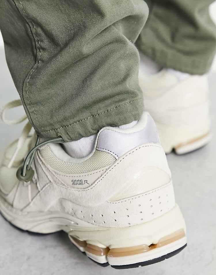 New Balance 2002 sneakers in green multi